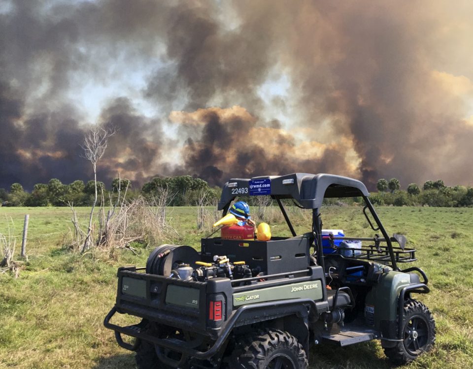 District staff keeping an eye on a prescribed fire