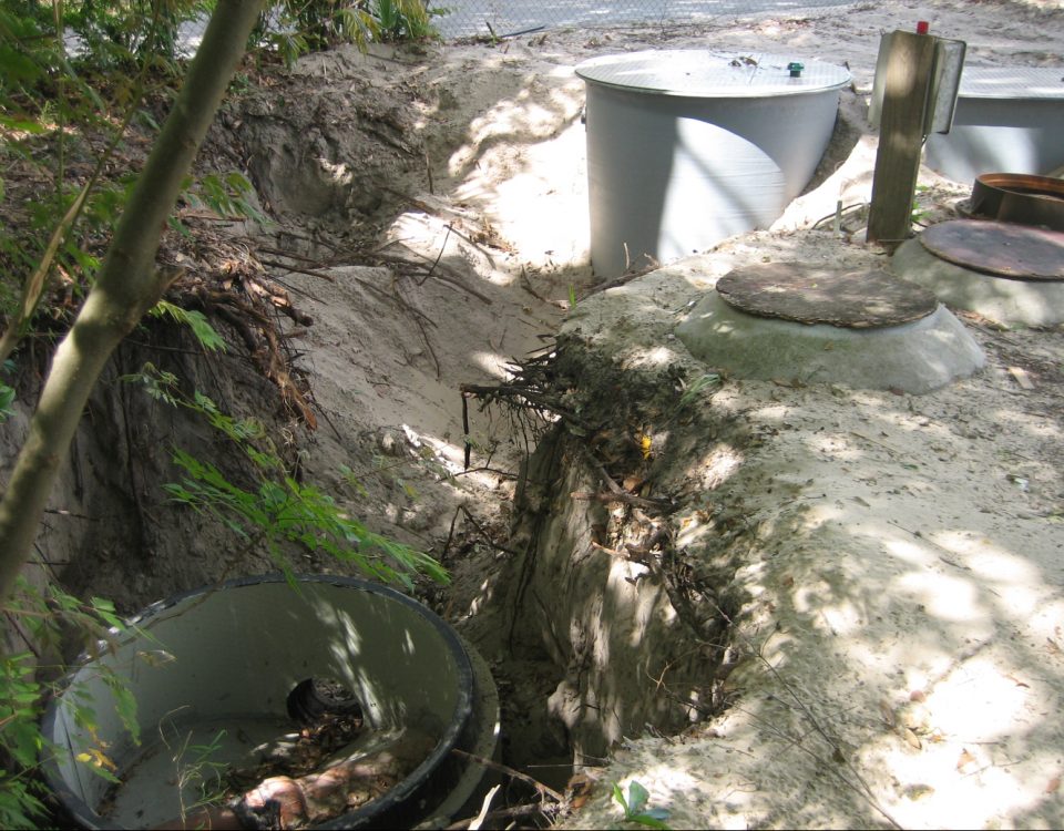 Construction site with large pipes coming out of the ground