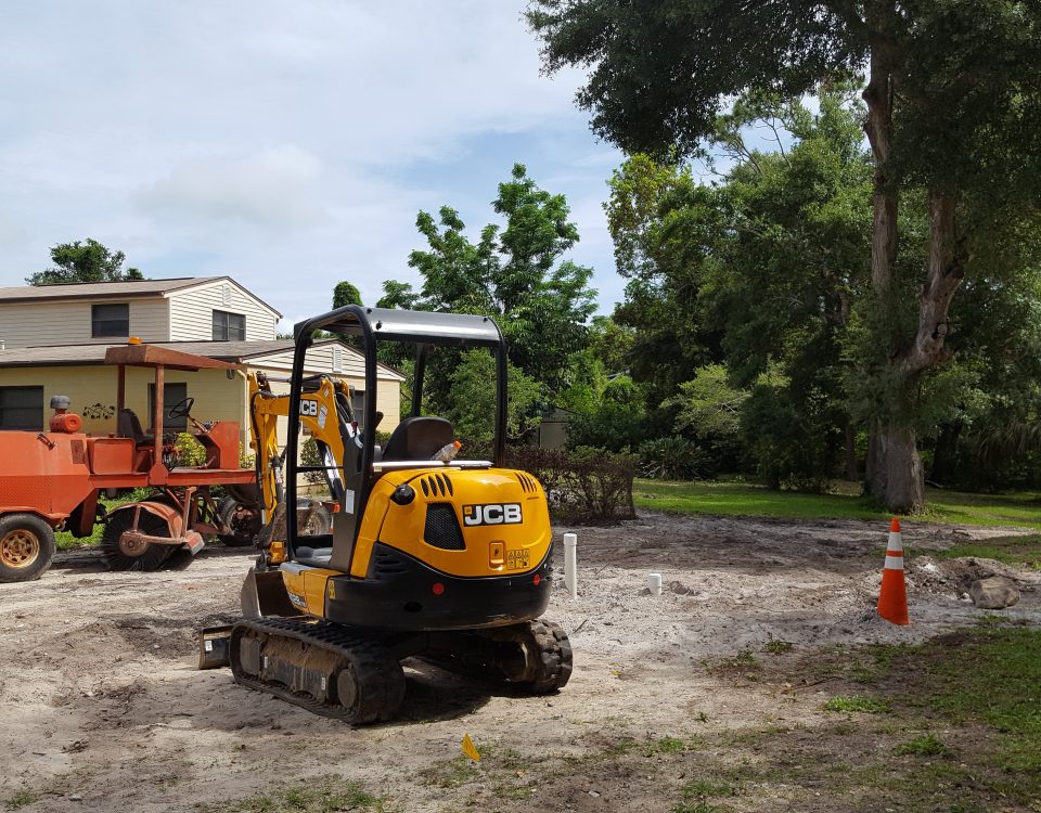 Construction equipment sitting outside of a house