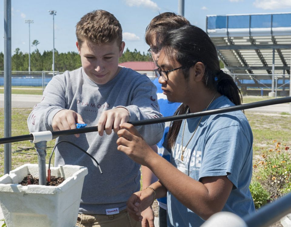 Blue School grant program students working in a garden