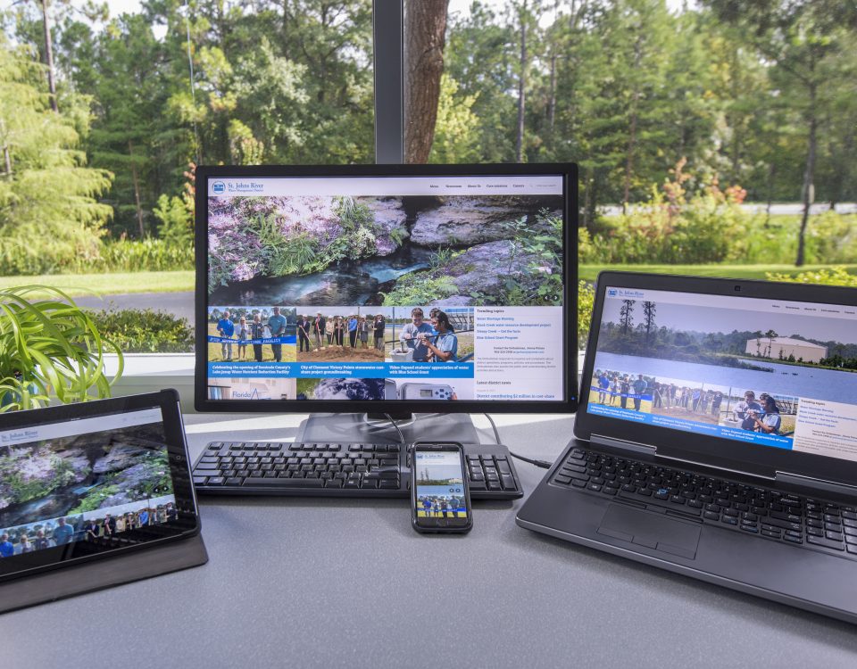 Tablet, phone, desktop and laptop computers showing the district's website