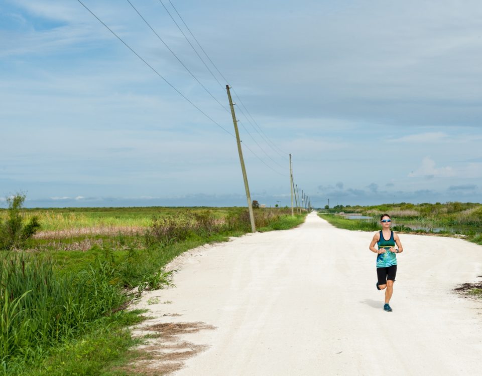 Person running on trail at Lake Apopka North Shore