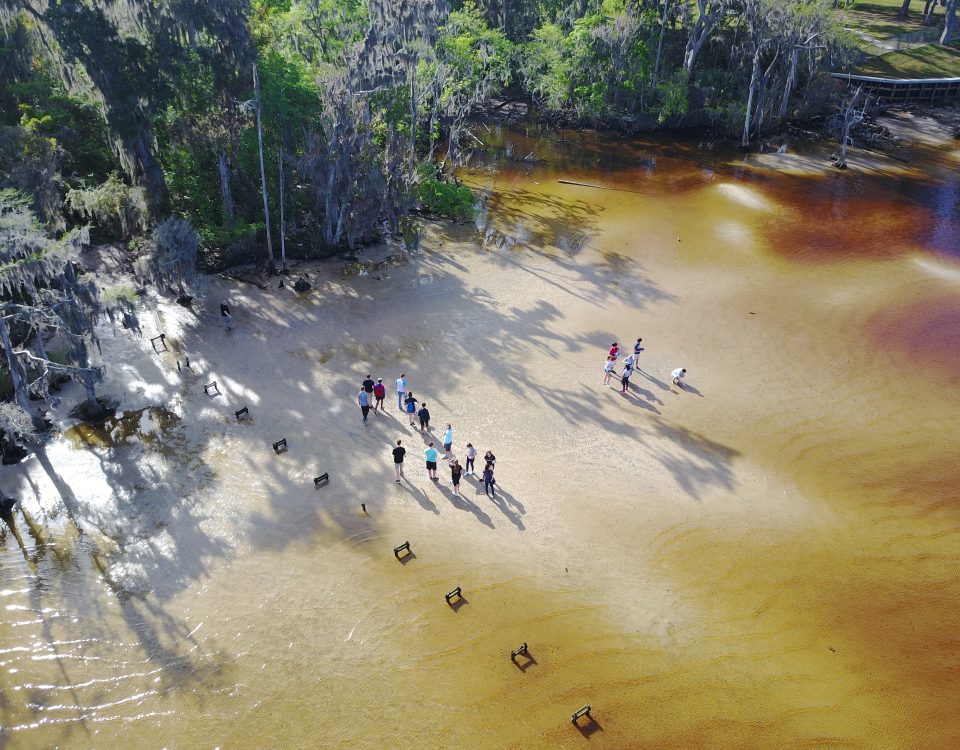 Aerial of students on the shore of the St. Johns River near Jacksonville