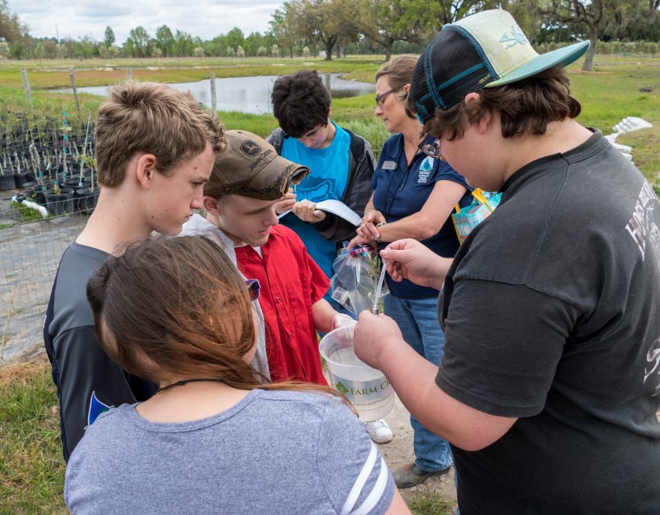 Students looking at water quality tests