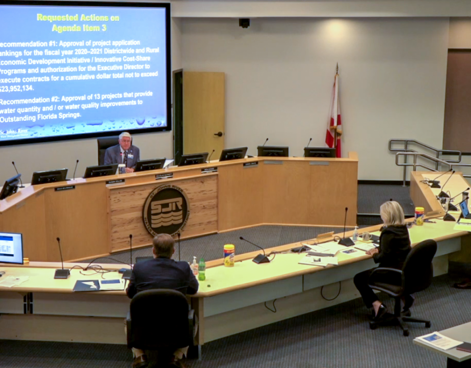 Douglas Burnett leading a Governing Board meeting