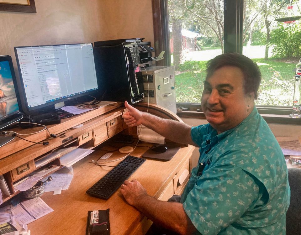 Dr. Erich Marzolf sitting at his desk