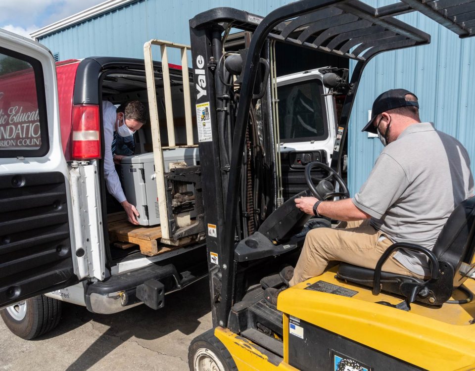 Man lifting equipment using a forklift