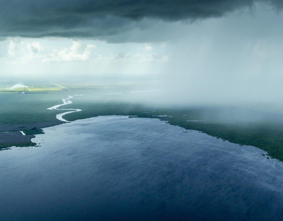 Aerial view of a rain storm moving over Florida lands