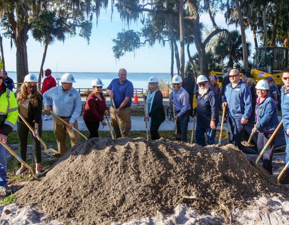 The District’s Clay Coarsey (middle) and partners participate in a groundbreaking ceremony