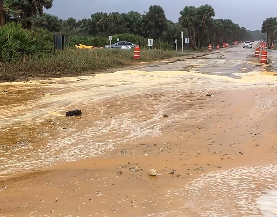 Sand washed over a road