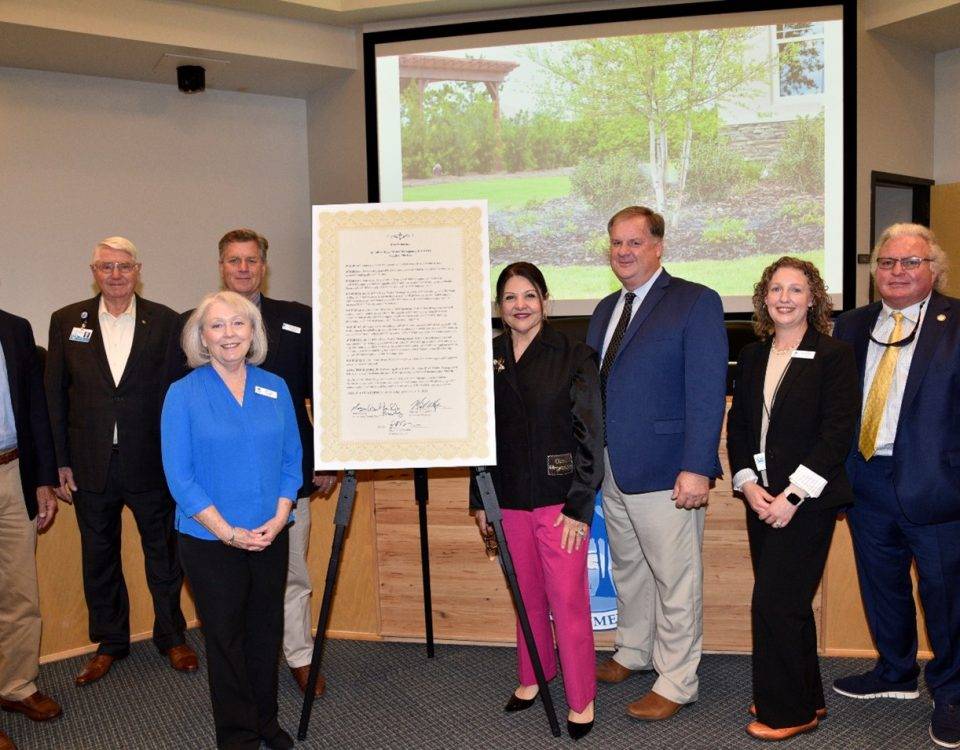 Governing board members pictured by a proclamation