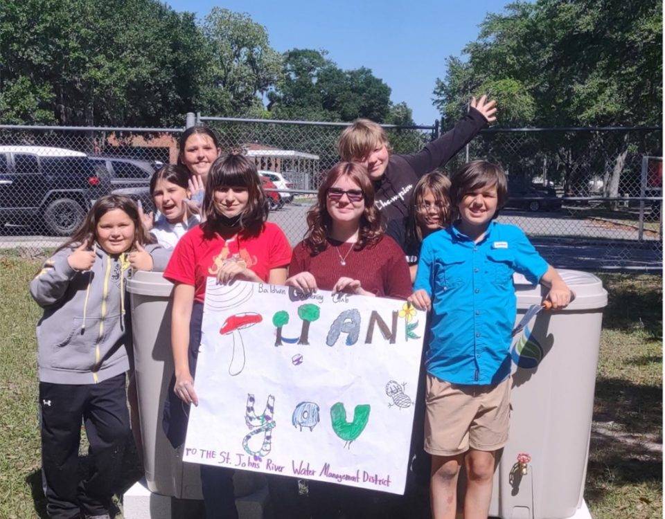 Students holding a sign