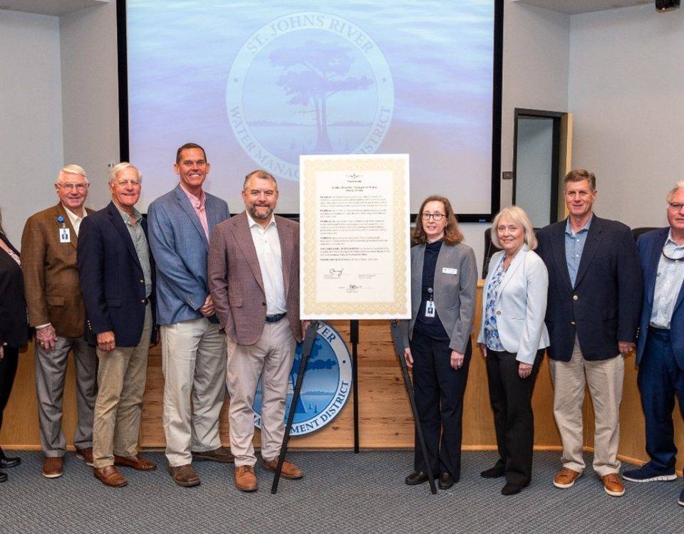 Governing board members pictured next to a proclamation