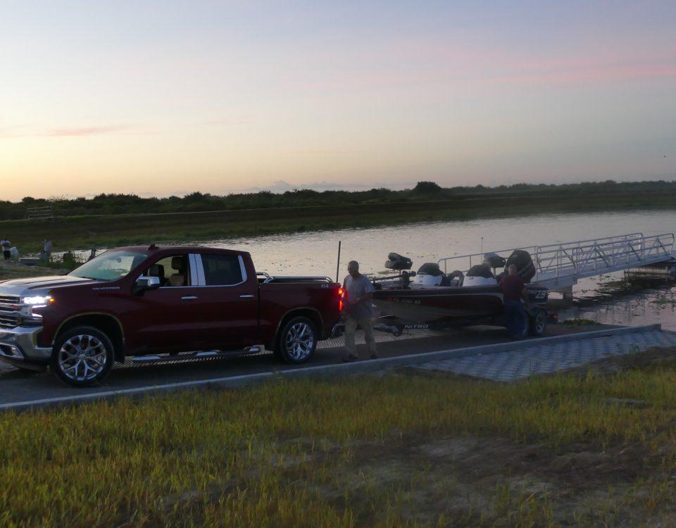 Person getting ready to launch a boat at dawn